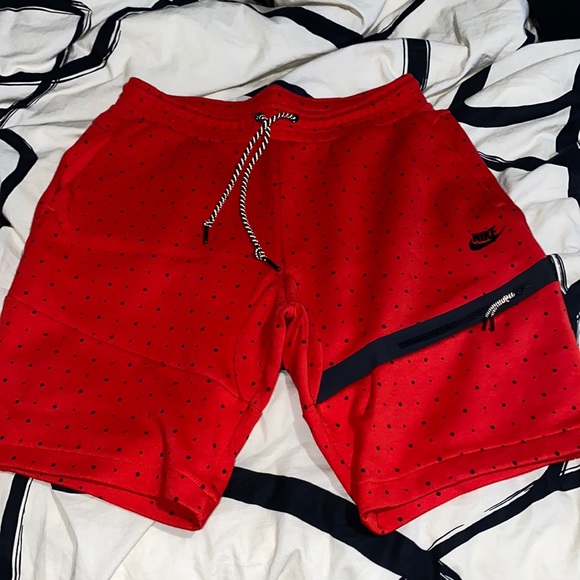 red nike tech shorts